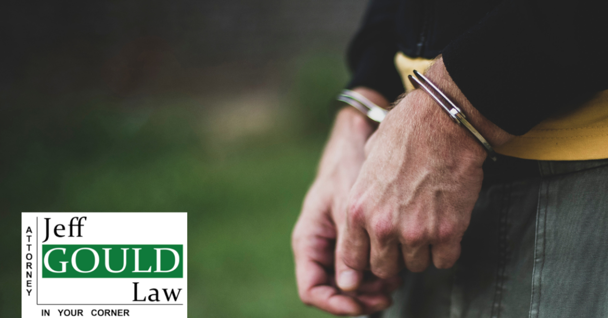 criminal activity, hands in handcuffts, jeff gould law, criminal defense